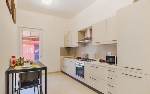 Appartamento Paola: Indretning, Gulvbelægning, Countertop, Møbel, Køkken, Etage, Køkken Apparat, Loft, Cabinetry, Større Bandage