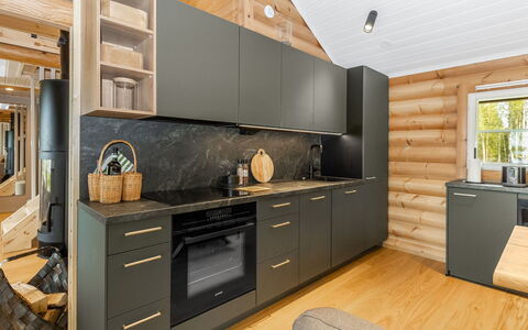 Villa Praava a: Gulvbelægning, Træ, Køkken, Møbel, Indretning, Countertop, Cabinetry, Etage, Trægulve, Køkken Apparat