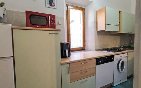 Casa Lelà: Køkken Apparat, Større Bandage, Køkken, Træ, Gulvbelægning, Countertop, Cabinetry, Etage, Husholdningsapparat, Indretning