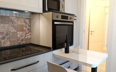 Oasi Blocco a: Gulvbelægning, Indretning, Køkken, Countertop, Etage, Køkken Apparat, Større Bandage, Møbel, Cabinetry, Værelse